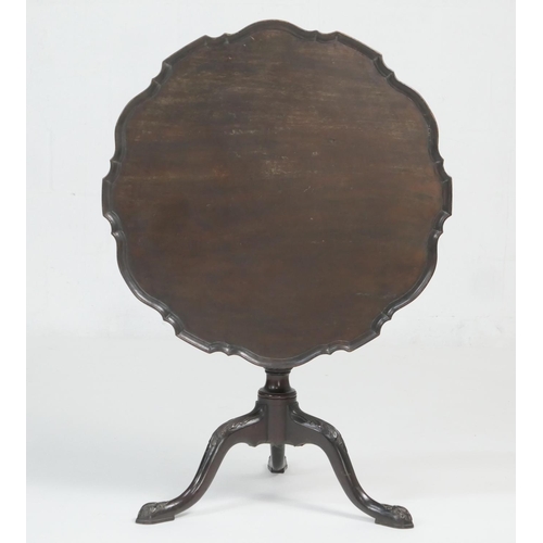 914 - Mahogany piecrust edge tilt top tripod table, in Chippendale style, shaped tilting circular top over... 