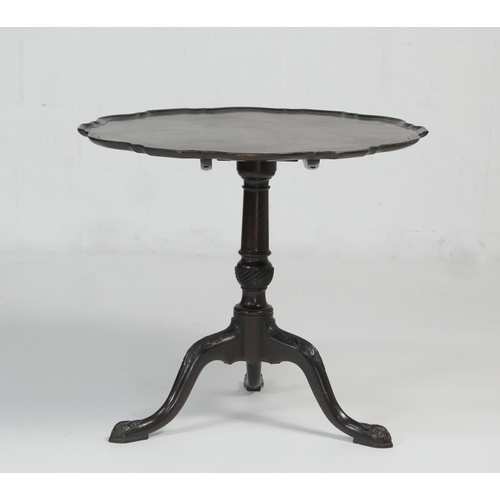 914 - Mahogany piecrust edge tilt top tripod table, in Chippendale style, shaped tilting circular top over... 