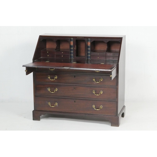 923 - George III mahogany bureau, circa 1770, the slope front opening to pigeonholes and drawers with two ... 