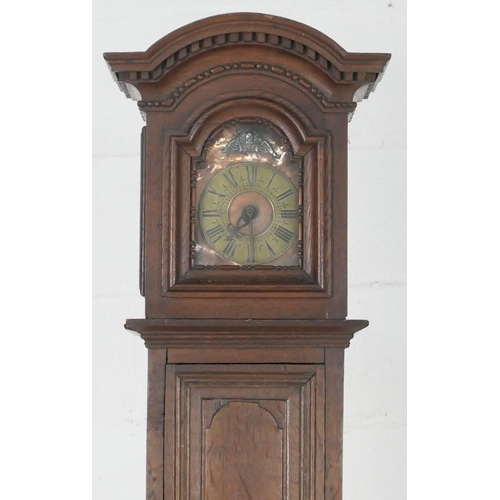 945 - Unusual oak 30 hour longcase clock, possibly Dutch, the hood with dentil arch enclosing a 6 inch cop... 