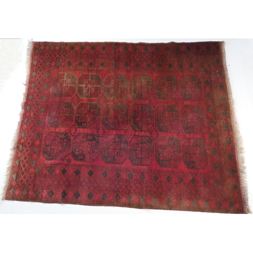 946 - Turkish deep red ground bokhara carpet, with three rows of guls in a wide border, size approx. 300cm... 