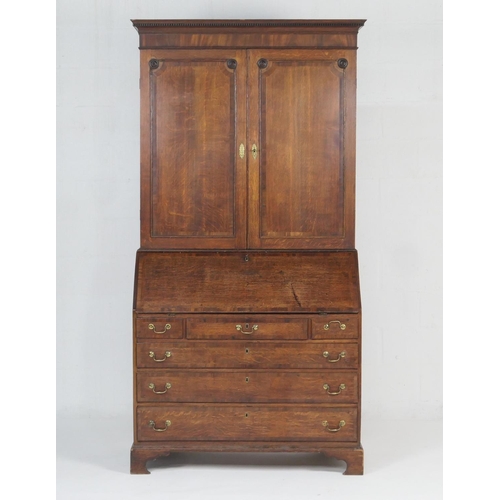 947 - Late George III oak bureau bookcase, circa 1800-20, dentil moulded cornice over two moulded panel do... 