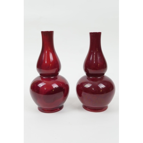 96 - Pair of Bernard Moore red flambe double gourd vases, one numbered 1069 (restored at the neck), the o... 