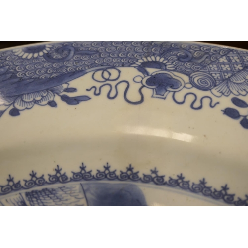 70 - Chinese Export blue and white charger, Qianlong (1736-95), decorated with figures under a willow tre... 