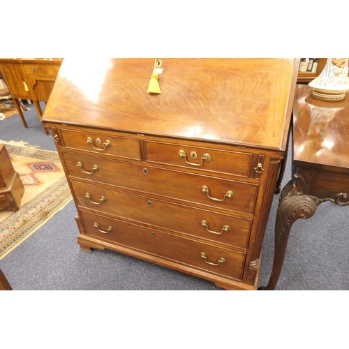 915 - George III mahogany bureau, circa 1780, the slope front opening to an attractive configuration of pi... 