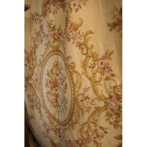 655 - Aubusson style needlework bedspread, worked with a central floral cameo within multiple floral spray... 