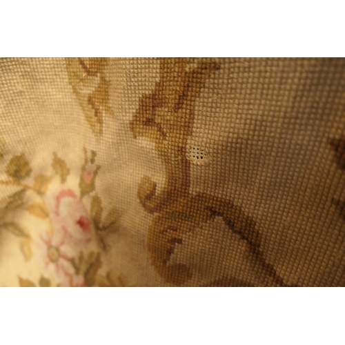 655 - Aubusson style needlework bedspread, worked with a central floral cameo within multiple floral spray... 