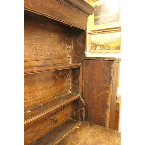 931 - George II oak enclosed dresser and plate rack, North Wales, circa 1720-40, boarded rack with ogee mo... 