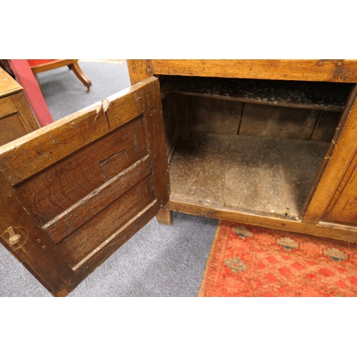 931 - George II oak enclosed dresser and plate rack, North Wales, circa 1720-40, boarded rack with ogee mo... 