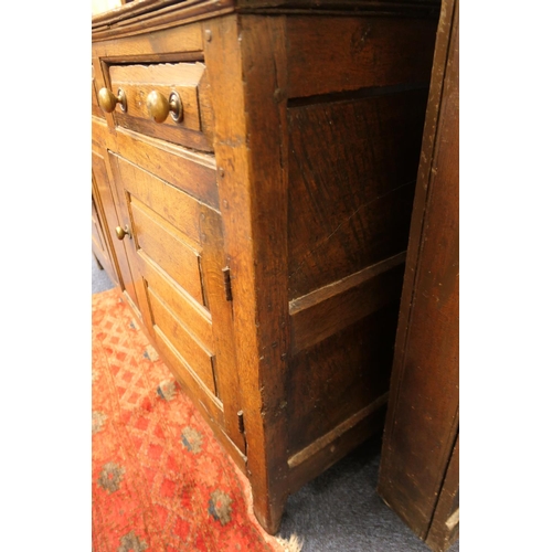 931 - George II oak enclosed dresser and plate rack, North Wales, circa 1720-40, boarded rack with ogee mo... 