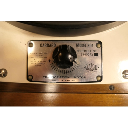 670 - 1960s walnut stereo cabinet enclosing a Garrard model 301 turntable (with replaced Linn Basik Plus t... 