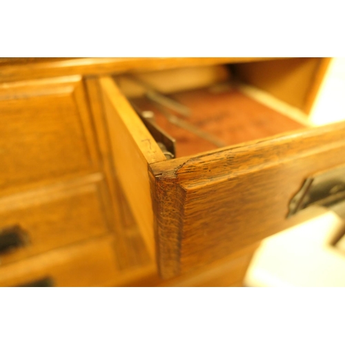 956 - Oak sectional bookcase in Globe Wernicke style, having a three section bookcase top with up and over... 