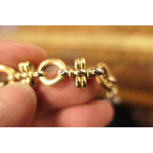 390 - 18ct gold circular and cross bar link bracelet, with large ring clasp, length 21cm, weight approx. 1... 