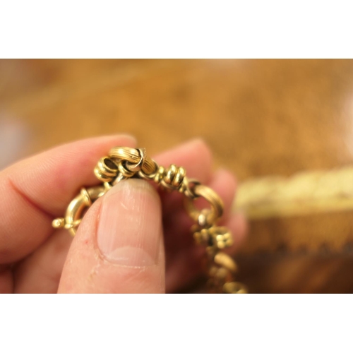 390 - 18ct gold circular and cross bar link bracelet, with large ring clasp, length 21cm, weight approx. 1... 