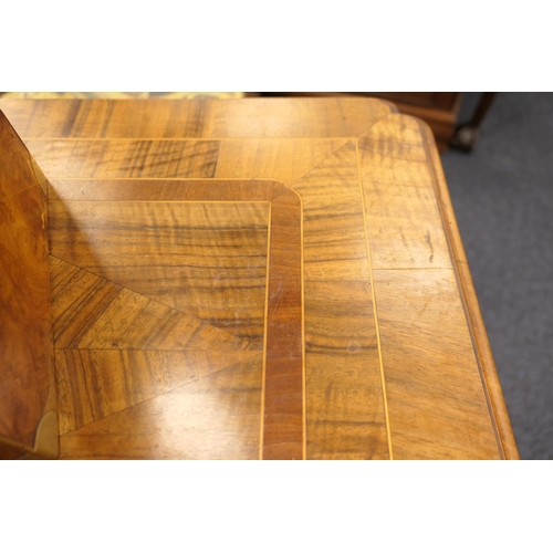 884 - Walnut side table, 18th Century with later restoration, the rectangular top with kick-in corners and... 