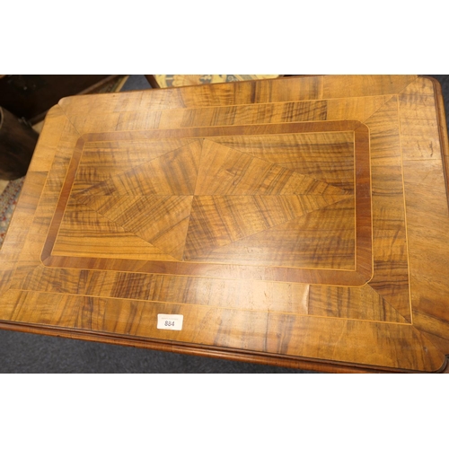 884 - Walnut side table, 18th Century with later restoration, the rectangular top with kick-in corners and... 