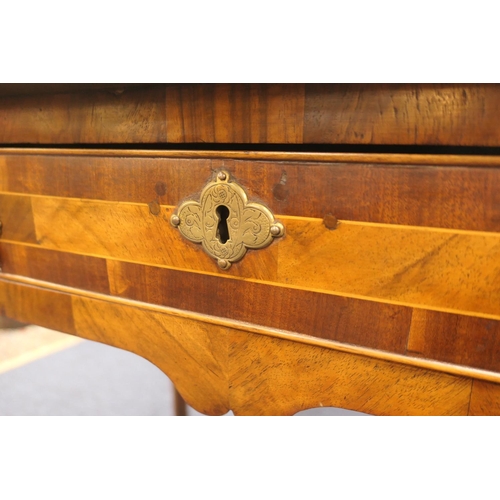 884 - Walnut side table, 18th Century with later restoration, the rectangular top with kick-in corners and... 