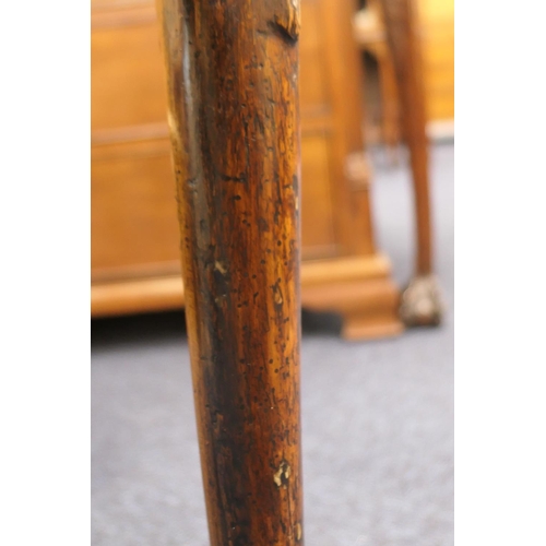 884 - Walnut side table, 18th Century with later restoration, the rectangular top with kick-in corners and... 