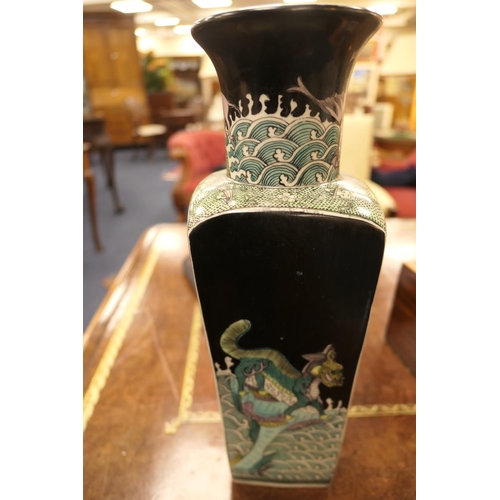 9 - Chinese famille noir vase, square section beneath a trumpet neck, decorated with mythical beasts, Ka... 