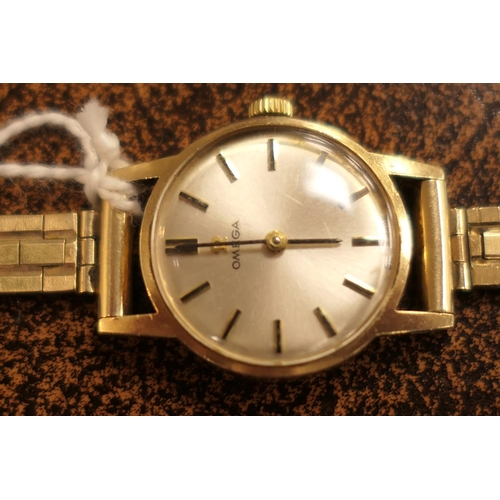 304 - Omega 9ct gold lady's bracelet wristwatch, 17mm dial with baton numerals, manual wind, on a 9ct gold... 