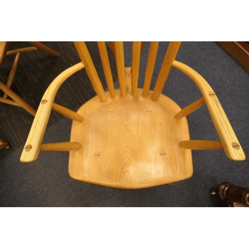 912 - Pair of hand crafted ash and elm comb back Windsor chairs, shaped seat and urn legs with H-stretcher... 