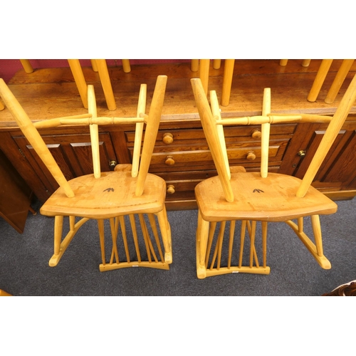 912 - Pair of hand crafted ash and elm comb back Windsor chairs, shaped seat and urn legs with H-stretcher... 