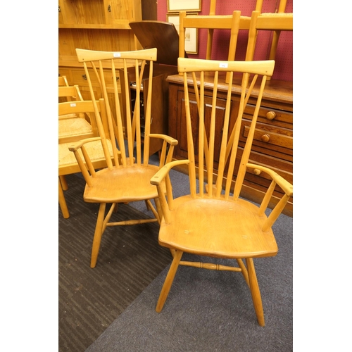 912 - Pair of hand crafted ash and elm comb back Windsor chairs, shaped seat and urn legs with H-stretcher... 