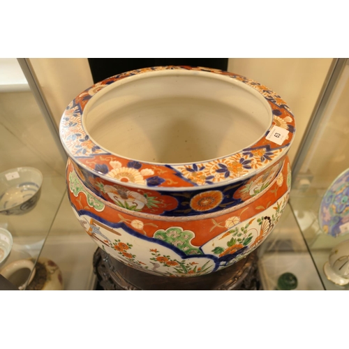 63 - Japanese Imari porcelain jardiniere, late Meiji (1868-1912), decorated with panels of waterfowl in a... 