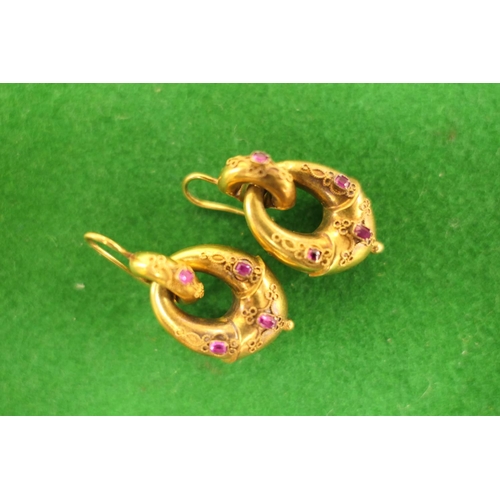 379 - Pair of Victorian gold and ruby cannetille double loop pendant earrings, each set with four small ru... 