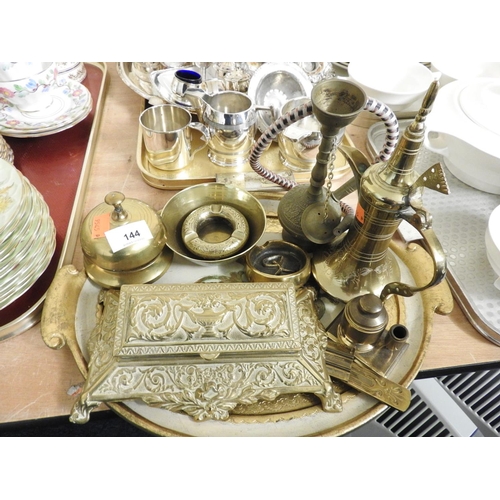 144 - Small quantity of brassware including a Victorian cast coin holder, desk bell, Indian brassware etc ... 