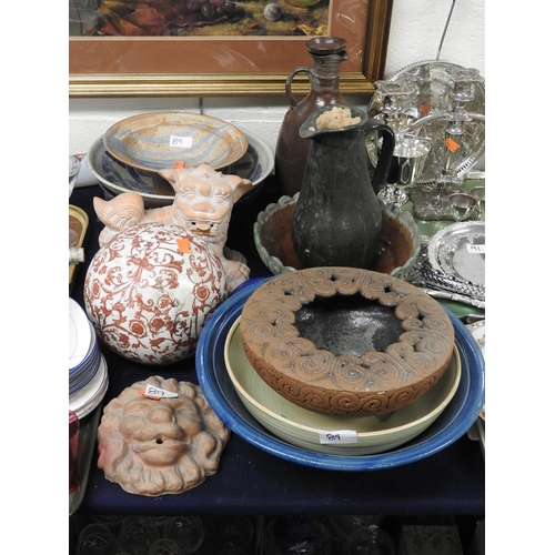 89 - Assorted Art pottery including bowls, water jug, dog of Fo, unusual pottery post finial and a lion m... 