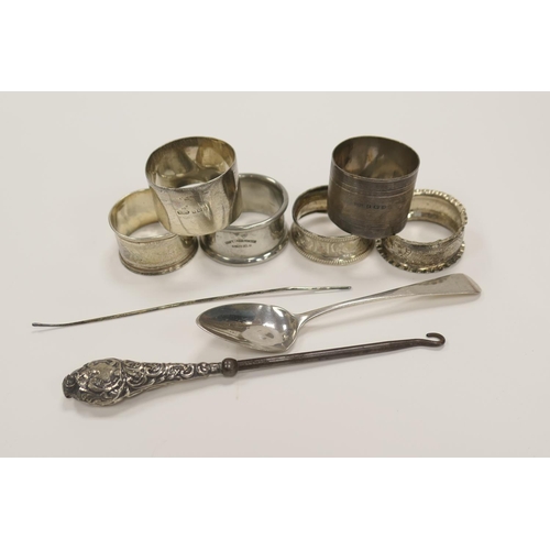 329 - Five silver napkin rings, Georgian silver teaspoon, weight approx. 97g; also a silver handled steel ... 