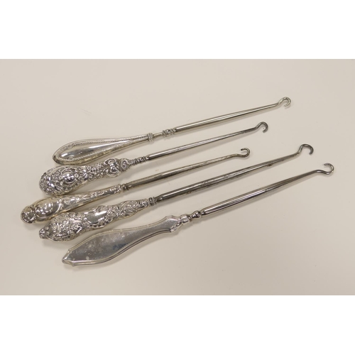 334 - Five silver handled steel button hooks, various hallmarks