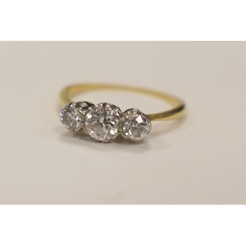 378 - Diamond three stone ring centred with a stone of approx. 0.5ct, flanked on either side with a furthe... 