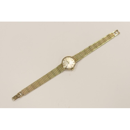 379 - Omega lady's 9ct gold mesh bracelet wristwatch, case 19mm, (currently not working), gross weight app... 