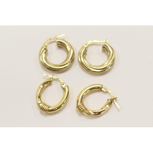 411 - Two pairs of 9ct gold hollow hoop earrings, gross weight approx. 3.8g