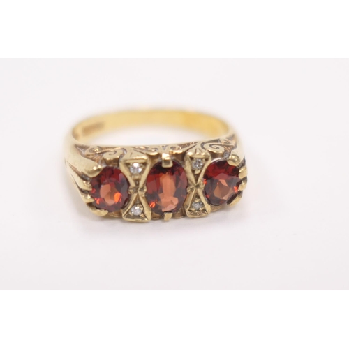 413 - Garnet and diamond cluster ring in 9ct gold, ring size N, gross weight approx. 4.1g