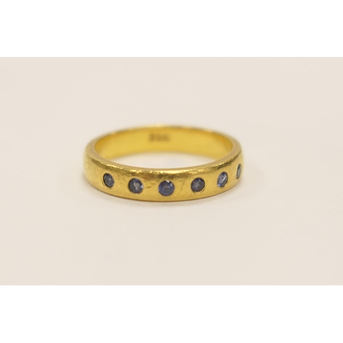 417 - Sapphire six stone gypsy set ring in 22ct gold set with small round cut stones, ring size P, gross w... 