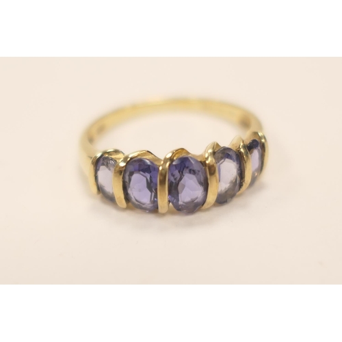 428 - Decorative 9ct gold blue gem set dress ring set with five oval cut stones (untested), ring size P, g... 