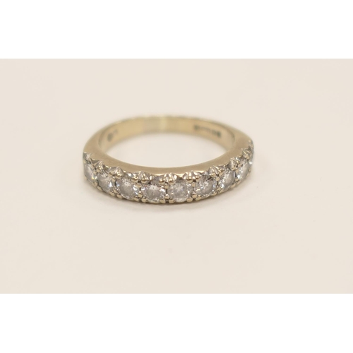 435 - Diamond half eternity ring in 18ct white gold set with nine round cut diamonds, totalling approx. 1c... 