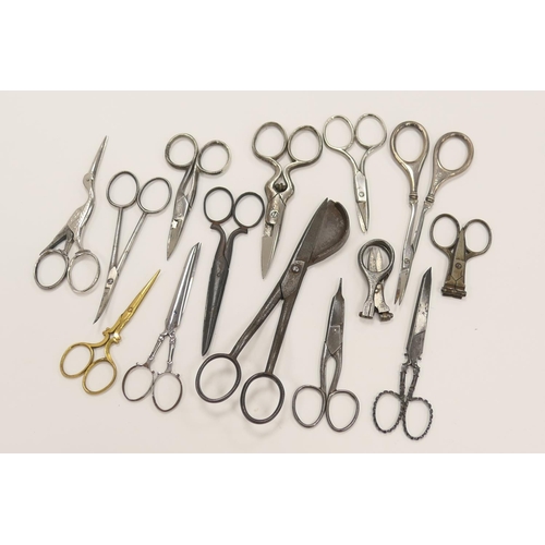 451 - Collection of vintage scissors including folding steel example and silver handled scissors etc.