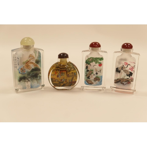 153 - Four modern Chinese internally decorated glass snuff bottles