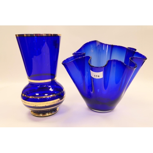 174 - Large blue glass handkerchief vase, height 23.5cm; also a further blue glass vase with gilt banded d... 