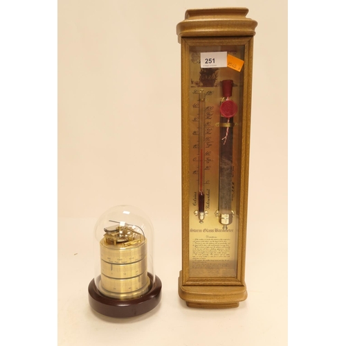 251 - Modern Admiral Fitzroy storm glass barometer and a modern brass cylinder form barometer combined the... 