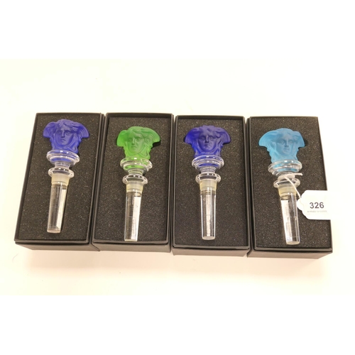 326 - Rosenthal glass for Versace, four coloured glass Medusa bottle stoppers