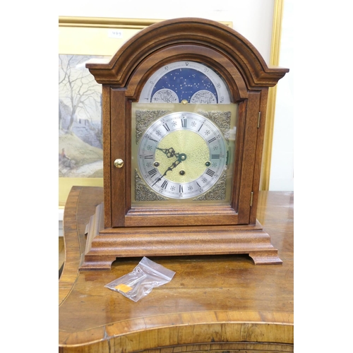 483 - Modern German walnut cased musical chiming mantel clock with moon phase, height 42cm