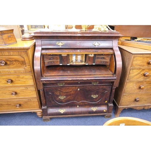 595 - Continental mahogany cylinder front bureau fitted with trompe l'oeuil fitted interior, probably Germ... 