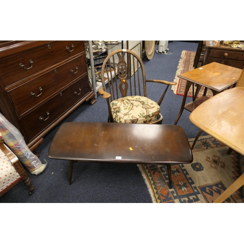 676 - Ercol dark stained elm coffee table, length 104cm; also an Ercol Prince of Wales feathers hoop back ... 