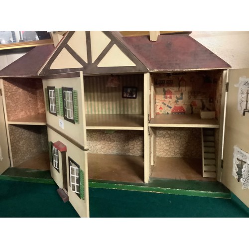 777 - Gable fronted doll's house complete with numerous accessories including furniture, china tea wares, ... 