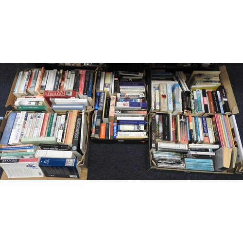 117 - Five boxes of paperback books including novels and language dictionaries